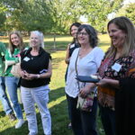 A group of parent supporters pictured together smiling at the 2025 Community Programming event for Adam's Way.